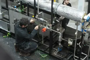 An operator assembling a reactor.